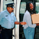 In this July 25, 1995 file photo, Mumia Abu-Jamal, convicted of killing a policeman, arrives at Philadelphia’s City Hall. Former death row inmate Abu-Jamal is back in court Thursday, Aug. 30, 2018, requesting that his failed appeals attempts be vacated, so he can once again appeal his case. The former Black Panther spent 29 years on death row following his conviction in the 1981 murder of Philadelphia police Officer Daniel Faulkner.